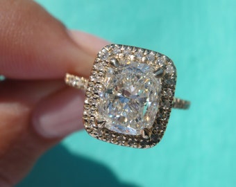 2.00 Yellow Gold halo ring with a 1.50 I si1 GIA center Cushion cut
