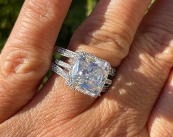 10x10 Moissanite Cushion cut center in white gold halo and 2 bands