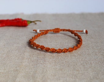 Tiny Friendship Bracelet in orange brown, adjustable Corded Macramé Bracelet, Unisex festival Jewelry by Reef Knot co