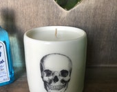 Hand thrown white porcelain cylinder,embellished with three Victorian era skulls.Scented in Gingerbread