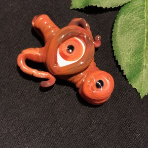 Glass cyclops monster pendant