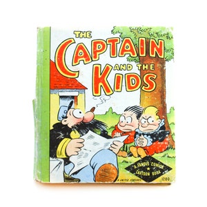 May include: A vintage comic book cover featuring a cartoon illustration of a man with a mustache and a pipe, reading a newspaper, with two children behind him. The title of the comic book is "The Captain and the Kids".