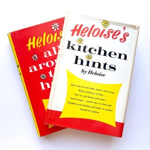 May include: Two red and yellow hardcover books with the title "Heloise's Kitchen Hints by Heloise" on the top book. The bottom book has the title "Heloise all around the house" on the cover.