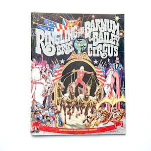 May include: A vintage program for the Ringling Bros. and Barnum & Bailey Circus, featuring a colorful illustration of elephants, clowns, and a ringmaster. The program is titled "The Greatest Show on Earth" and includes the text "Spectacular Bicentennial Edition".