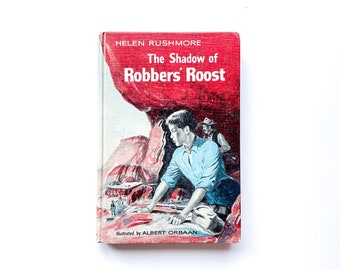 The Shadow of Robbers’ Roost | by Helen Rushmore | Illustrated by Albert Orbaan | Hardcover | 1960