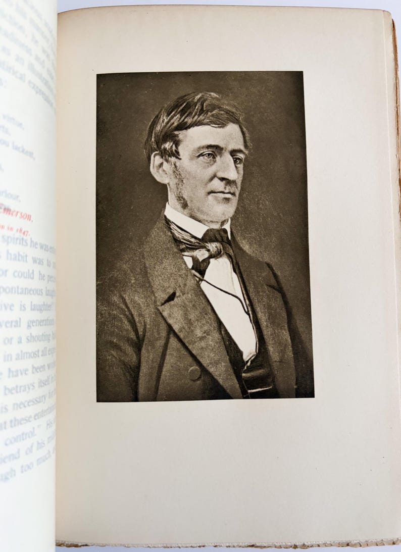 May include: A sepia-toned portrait of a man in a suit and tie, set within a book's pages. The man has short hair and a serious expression. The book's pages are off-white, with text visible on the left side.