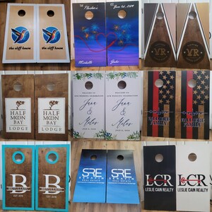 May include: A collage of nine pairs of wooden cornhole boards featuring various custom designs, including hummingbird graphics, fireworks, geometric patterns, wedding text, American flag motifs, and corporate logos with names and dates.
