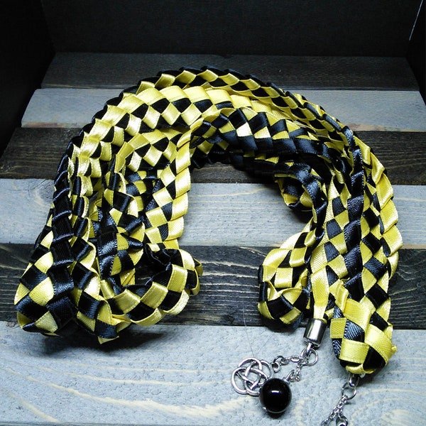 Tuxedo black and sunshine yellow satin handfasting ribbon capped with Celtic knot charms and evil eye agate