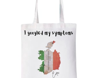 May include: White tote bag with a black graphic that says "I googled my symptoms turned out I just need to go to Ireland". The graphic also includes a map of Ireland with the Irish flag colors.