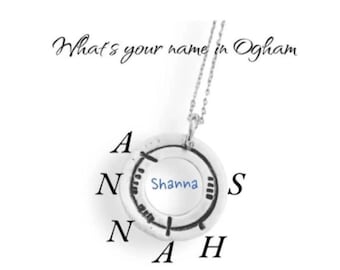 May include: A silver pendant necklace with the name "Shanna" in blue lettering. The pendant is circular with the name surrounded by the letters A, N, N, A, H, and S. The text "What's your name in Ogham" is at the top.