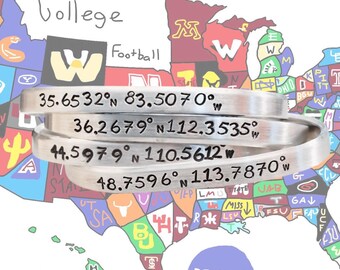 May include: Silver metal bracelets engraved with latitude and longitude coordinates, stacked in front of a colorful map of the United States. The word "College Football" is written above the bracelets. The NCAA logo is visible.
