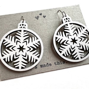 Snowflake earrings wood silhouette dangle white winter snow Statement jewelry lightweight laser cut wooden hoops Holiday Christmas earrings
