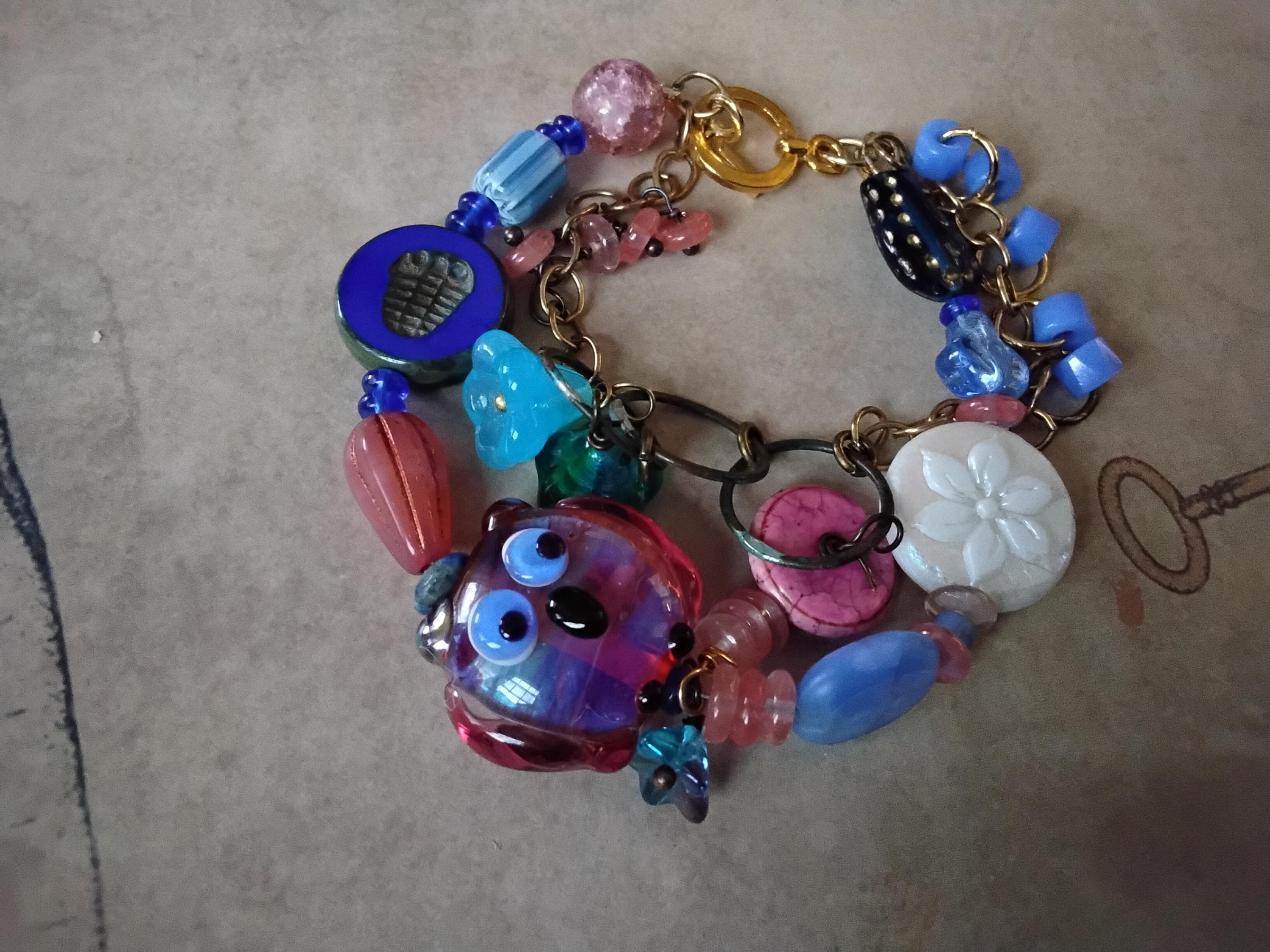 Handcrafted Lampworked Owl in a Multi Strand Boho Asymmetrical Bracelet with Cherry Quartz Charms Cz