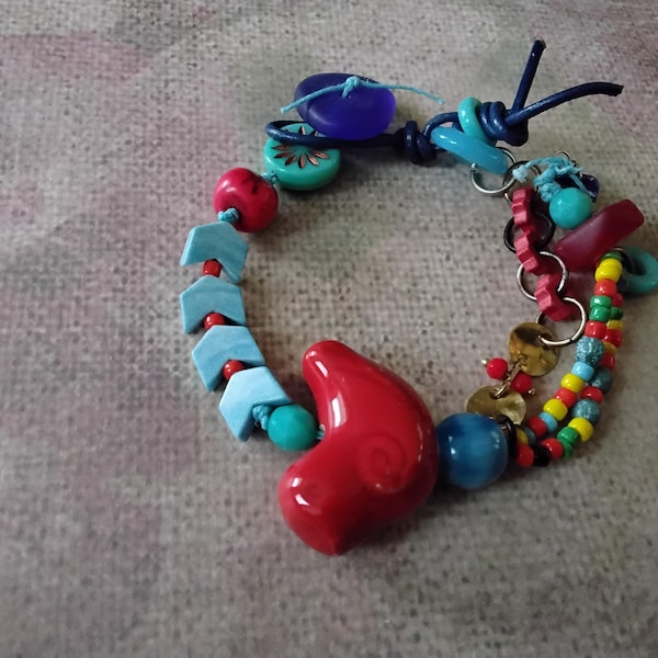 Asymmetrical Boho Bracelet with Ceramic Red BirdBlue Chevron Agate Seeds African Glass Ring and Recycled Blue Button
