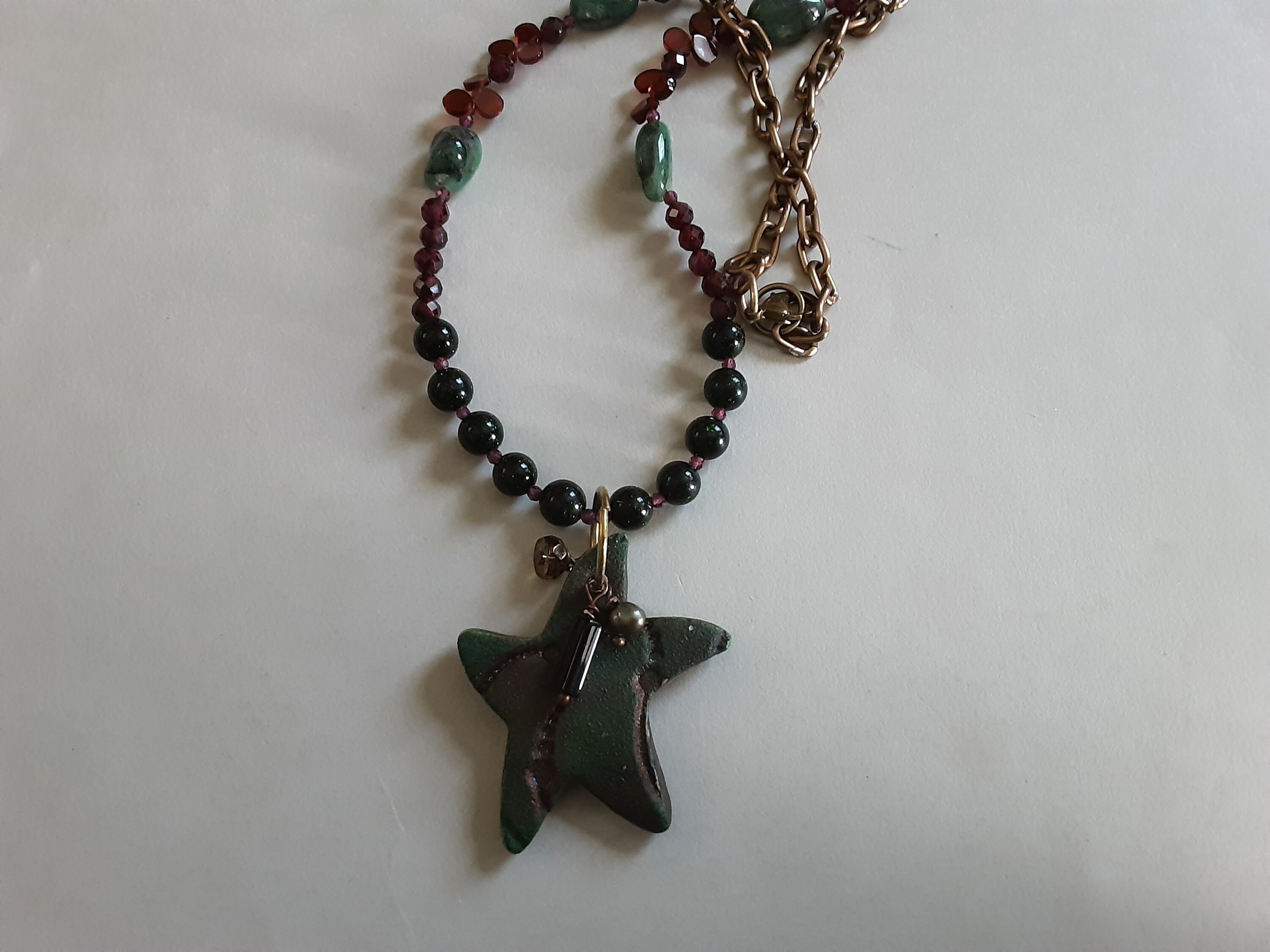 Handcrafted Ceramic Raku Starfish with Green Goldstone Emerald Nuggets and Garnets with Copper Chain and lobster claw
