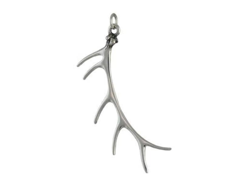May include: A silver pendant shaped like an antler with a delicate, intricate design. The antler is curved and has multiple points.