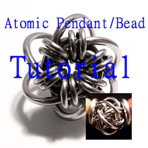 May include: A silver metal pendant or bead in the shape of a star with multiple loops. The pendant is made using a technique called "Atomic Knot". The image includes the text "Atomic Pendant/Bead Tutorial".