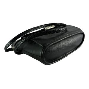 May include: Black leather crossbody bag with a braided strap. The bag has a rounded shape and a silver-toned clasp. The leather appears to have a textured grain. The strap is also black and braided.