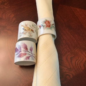 Mixed Set of 3 Porcelain or Ceramic Floral Napkin Rings or Holders, 2 are Signed Ann Smith, 1980s