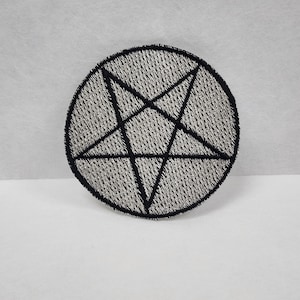 May include: Black and white embroidered patch of a pentagram inside a circle.
