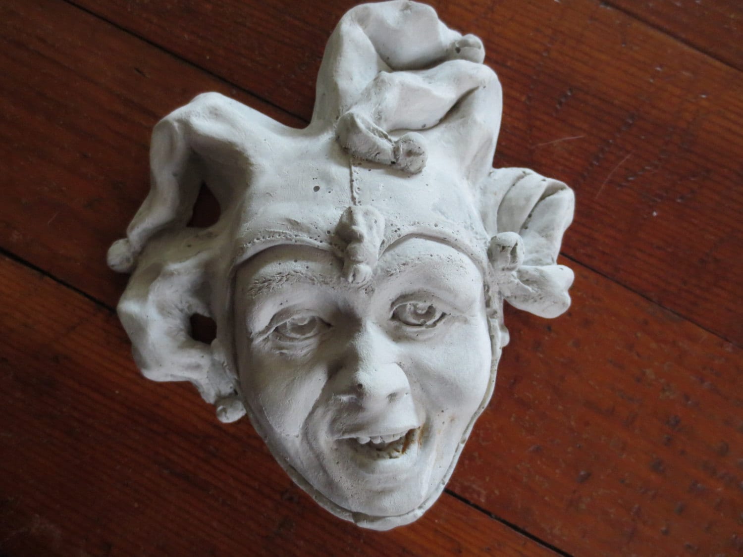 Foolish Jester, a Weatherproof Cast Stone Wall Sculpture by Claybraven