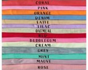 May include: A vertical stack of fabric swatches in various colors, each labeled with text including Peach, Mustard, Lavender, Sage, Khaki, Baby Blue, Turquoise, Coral, Pink, Orange, Denim, Latte, Lilac, Oatmeal, Red, Bubblegum, Cream, Grey, Mint, Mauve, Rose, Eucalyptus, Yellow, Taupe, White, Stone, Lime, and Apricot.
