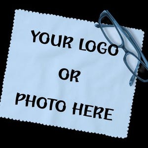 May include: A white ceramic mug with a black handle and the text "But First, Coffee" in a black, bold font. The mug is sitting on a white surface. The mug is approximately 4 inches tall.