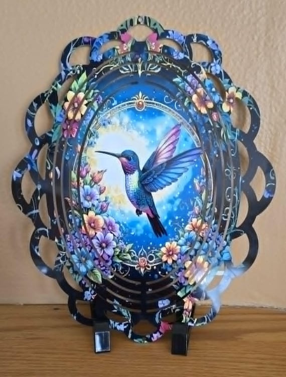 Bright, colorful Floral Hummingbird on Laced Oval-Shaped 10" wind spinner includes a glass crystal to hang from bottom, FAST SHIPPING!