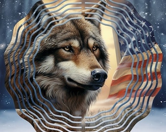 May include: A circular metal wind spinner featuring a detailed illustration of a brown and gray wolf head. The background displays a waving American flag with red, white, and blue stripes and stars, set against a snowy, wintry forest landscape.