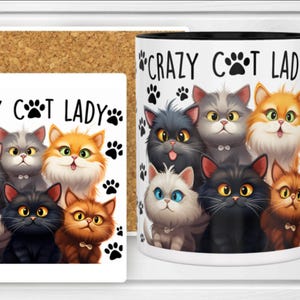 May include: A white ceramic mug with a black handle and a square cork-backed coaster, both featuring the text "CRAZY CAT LADY" and a graphic illustration of six fluffy cats in various colors, surrounded by small black paw print icons.