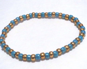 Blue and Gold bracelet made from Seed Beads and stretch cord. Light blue seed bead bracelet, stretchy bracelet. Golden bracelet, glass beads