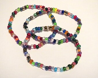 3 Multicolored stretch seed bead bracelets. Green, blue, orange, purple, yellow, pink, red beads. Customizable, perfect for kids or adults