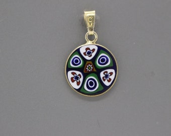 May include: A gold pendant with a round blue, green, white, and red enamel design.