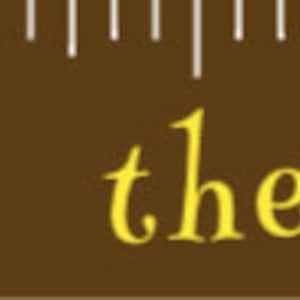 May include: A brown growth chart ruler with white markings and the text "Reach for the Stars" in a decorative font. Yellow stars are scattered across the ruler. The ruler measures up to 6 inches.