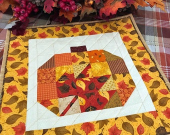 Pumpkin Quilted Table Topper, Halloween Wall Hanging, Autumn Table Runner Pumpkin with Pieced Red Maple Leaf, Orange Border, 18 x 18 inches