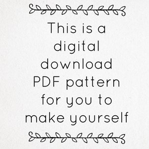 May include: A digital download PDF pattern with black text on a white background that reads: This is a digital download PDF pattern for you to make yourself. The text is framed by two horizontal decorative lines featuring a leaf vine motif.