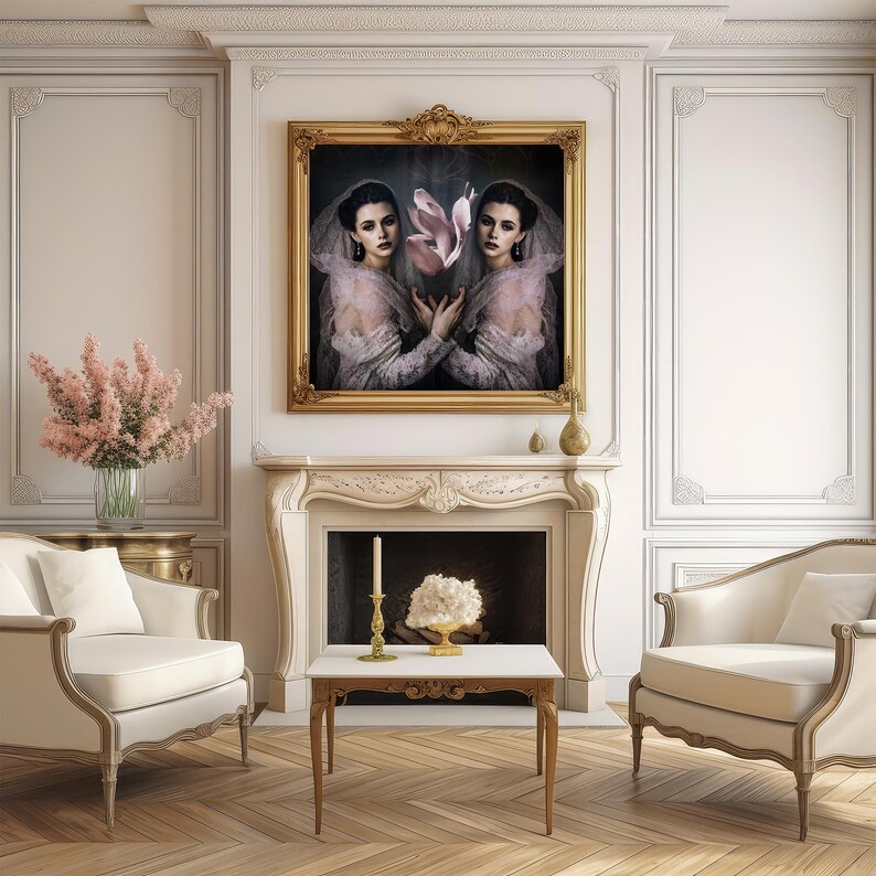 May include: An ornate living room featuring a large framed portrait above a fireplace. The portrait depicts two women in vintage attire holding a flower. The room includes two cream-colored armchairs, a small table, and a vase of pink flowers.
