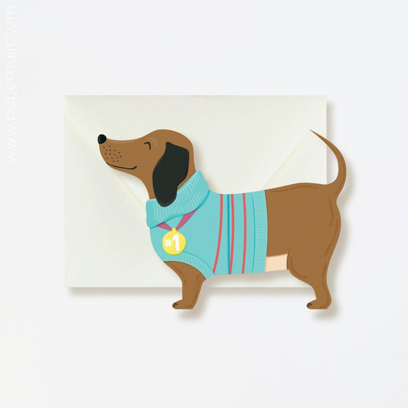 Carte de félicitations teckel extensible : chien viennoiseries découpé avec l'inscription « Vous êtes une vraie saucisse ! Jeu de mots pour l'obtention du diplôme et la célébration image 1