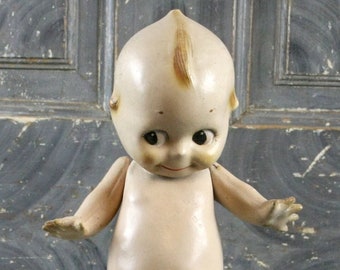Antique Composition Kewpie Doll Carnival Prize by Rose O'Neill, circa 1920s, jointed arms, blue base and wings