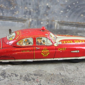 Collectible Marx tin lithograph wind up Dick Tracy fire chief car No 1 with working light, vintage