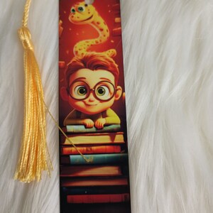 Bookmark-boy on a stack of books