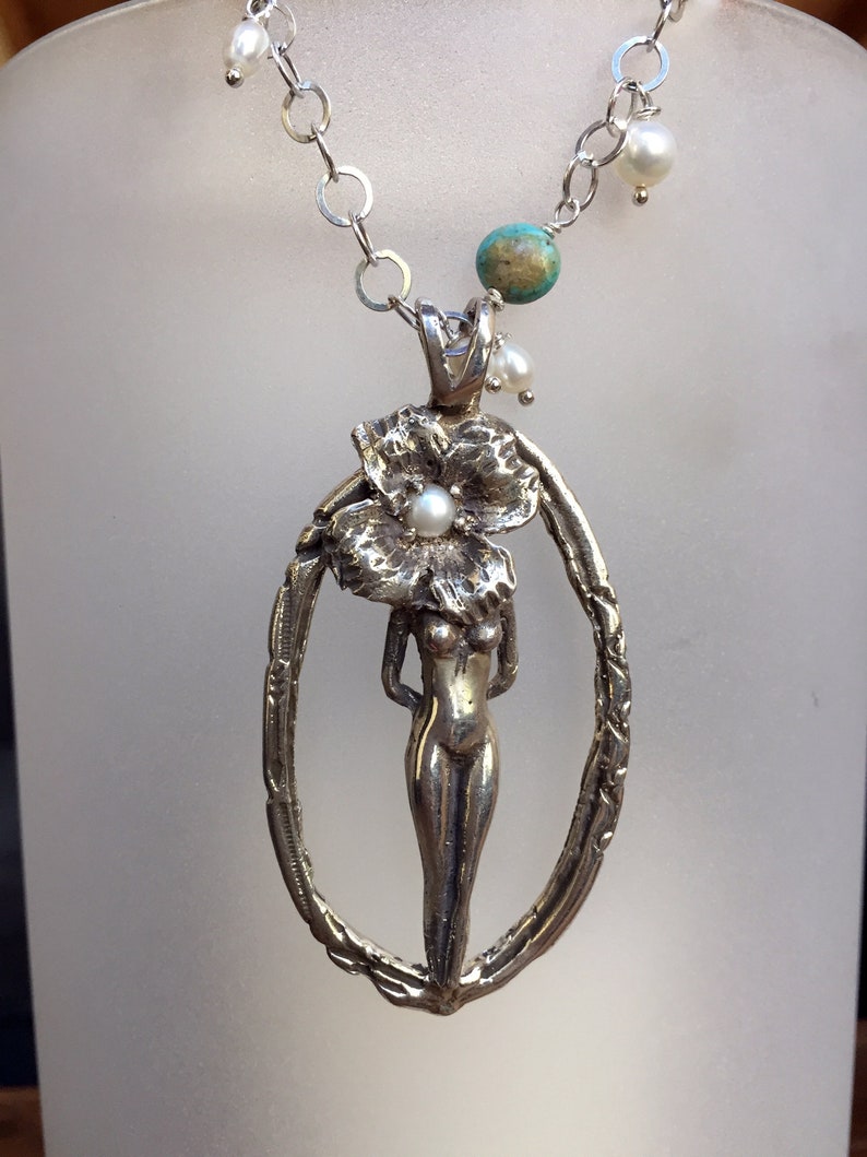 Kingman Turquoise and Natural Coral Sculptural Nude Figure with Flower in Sterling Silver with Freshwater Pearls