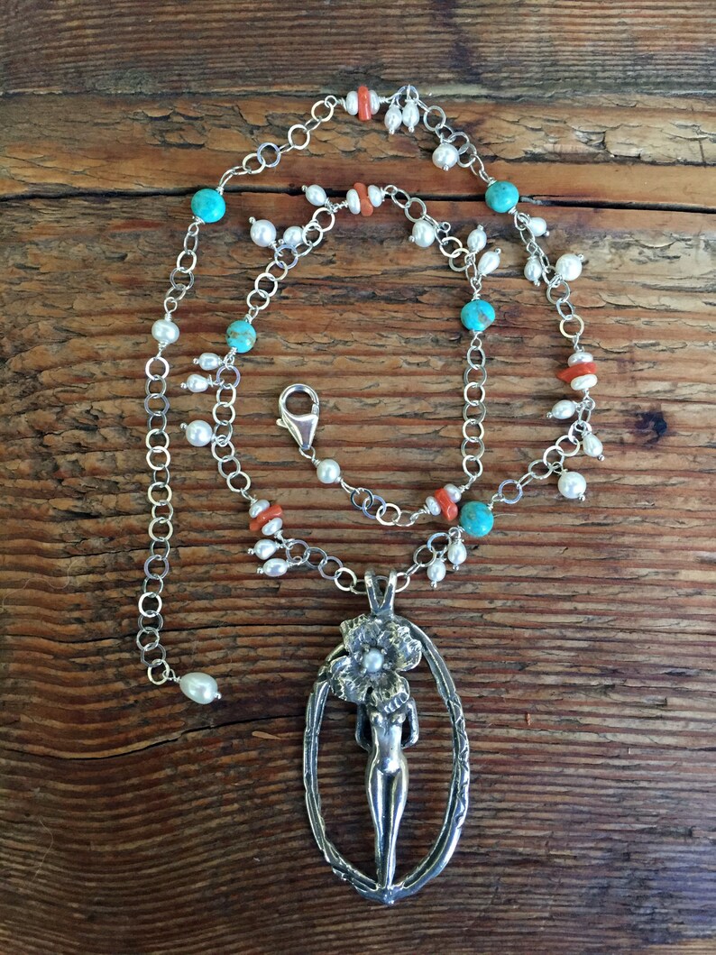Kingman Turquoise and Natural Coral Sculptural Nude Figure with Flower in Sterling Silver with Freshwater Pearls