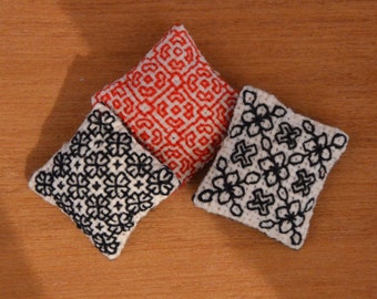 Blackwork Cushion, one inch scale dolls house pillow, hand embroidered dollhouse miniature in 1/12 scale