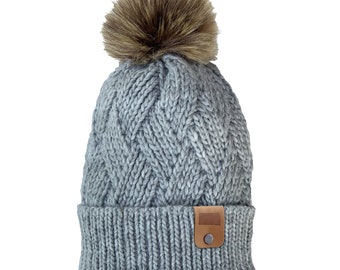 Women's Winter Hat Chunky Cable Knit Beanie South Dakota Leather Patch Faux Fur Pom Pom