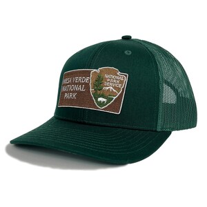 May include: A green trucker hat with a brown and white patch that says "Mesa Verde National Park" and "National Park Service".