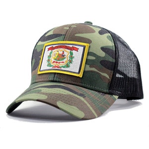 May include: A camouflage trucker hat with a black mesh back. The hat features a patch of the West Virginia state flag.