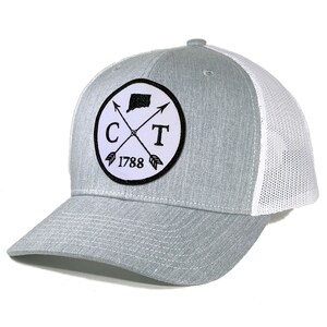 May include: A gray and white trucker hat with a black and white patch featuring the state of Connecticut, the letters "CT", and the year "1788".