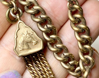 Antique Gold fill watch chain, Bracelet and tassel Fob.  Equestrian motif Fob. 8”, Curb chain, Spring ring. Victorian Jewelry