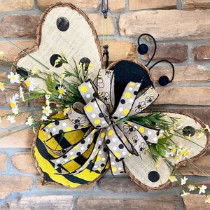 Bumble bee shaped door hanger wreath with flowers